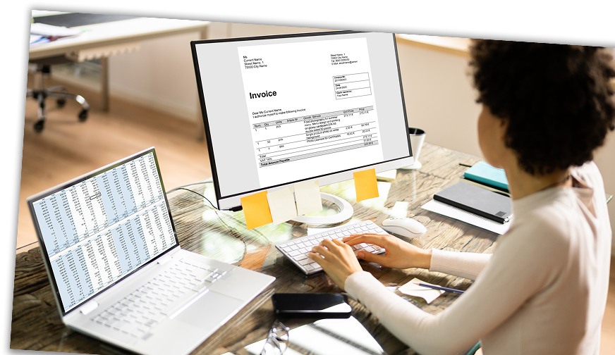 Accountant reading invoice on computer