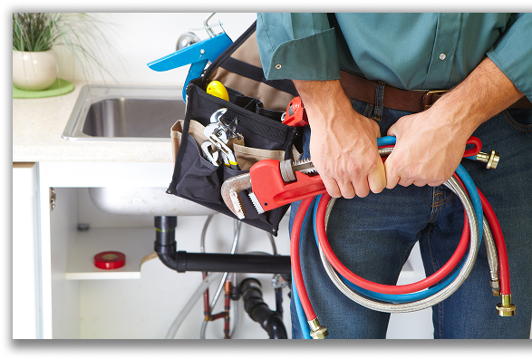 Plumber holding equipment in hand