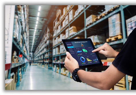 Man in warehouse looking at tablet