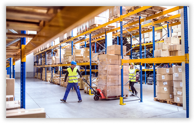 Warehouse workers moving boxes
