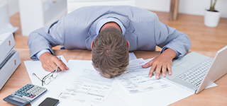 Businessman,Being,Depressed,By,Accounting,In,His,Office