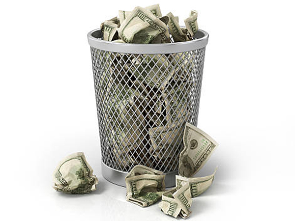 Money in basket. Isolated over white